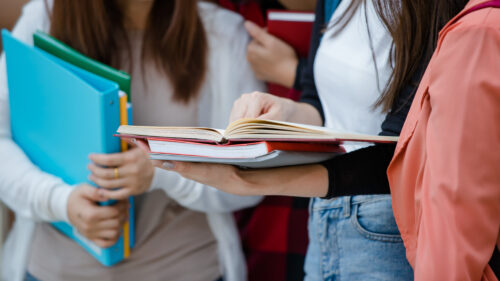 students reading textbooks